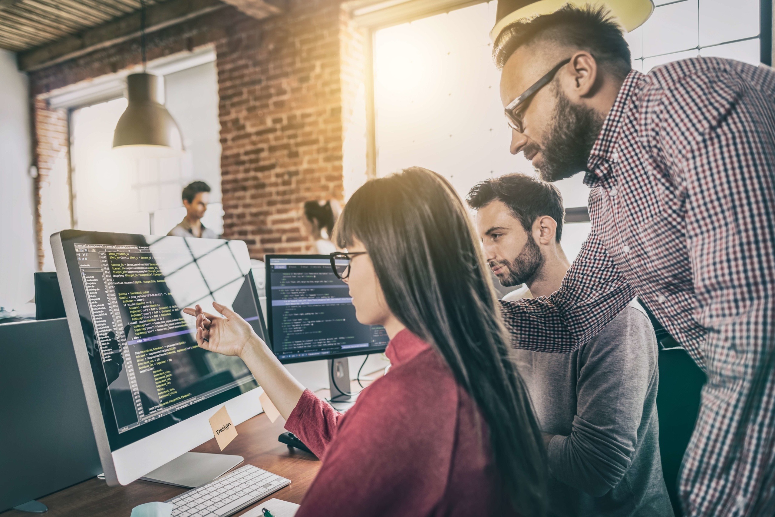 man helping his team implement a 3D kitchen planning solution