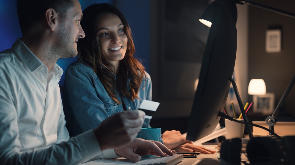 couple paying online with credit card