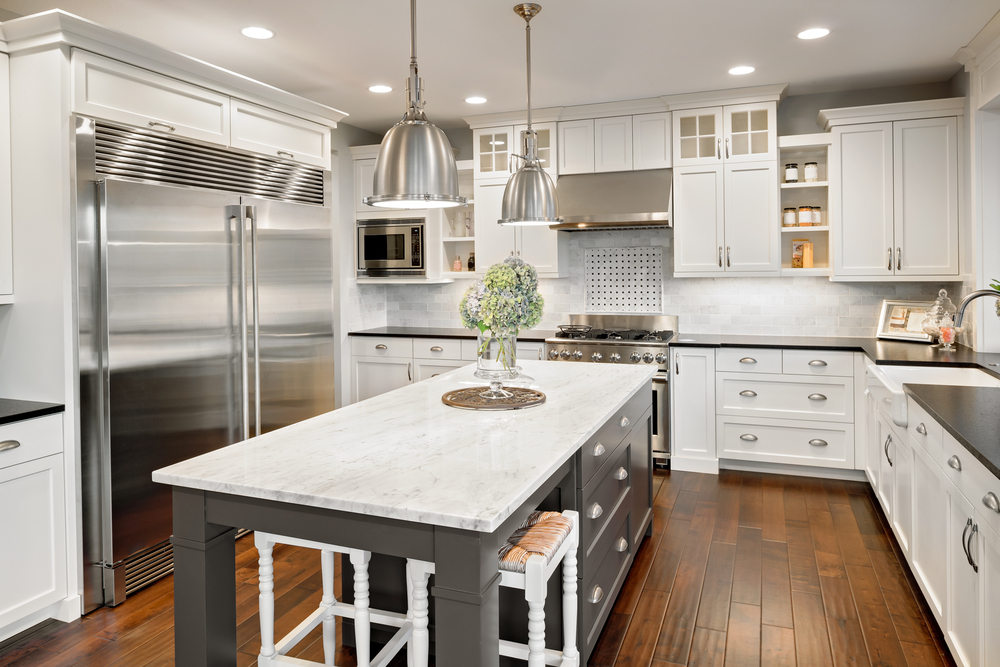 large kitchen with white countertop island and gray countertop